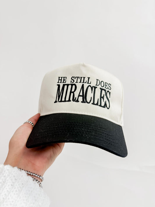 He Still Does Miracles Trucker Hat